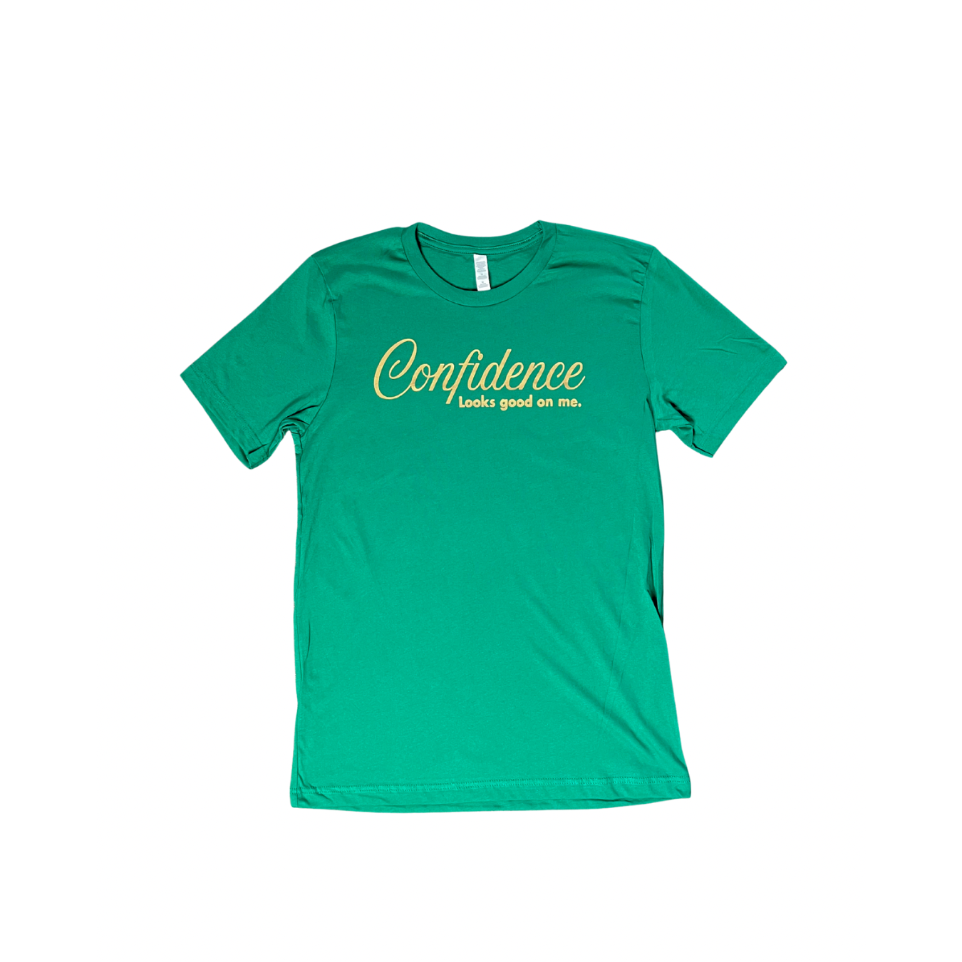 flat lay of kelly green t-shirt with 'Confidence looks good on me' text in metallic gold, on white background.