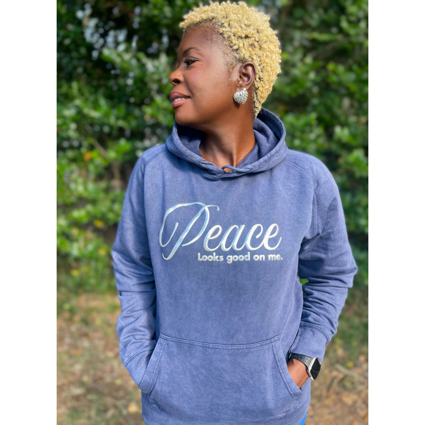 Shamere Young wearing Peace Looks Good on Me hoodie in vintage denim wash with metallic silver lettering - cozy Faith-based apparel for women