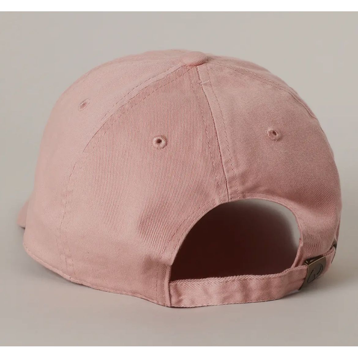 Pink cap on a light gray background