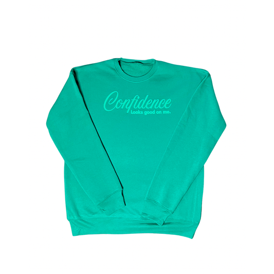 kelly green sweatshirt with puff wording saying "confidence looks food on me" on white background