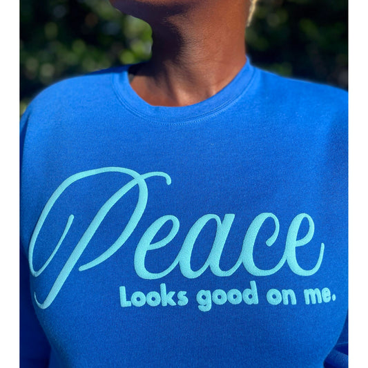 Peace Looks Good On Me royal blue sweatshirt with light blue lettering — Christian lifestyle brand