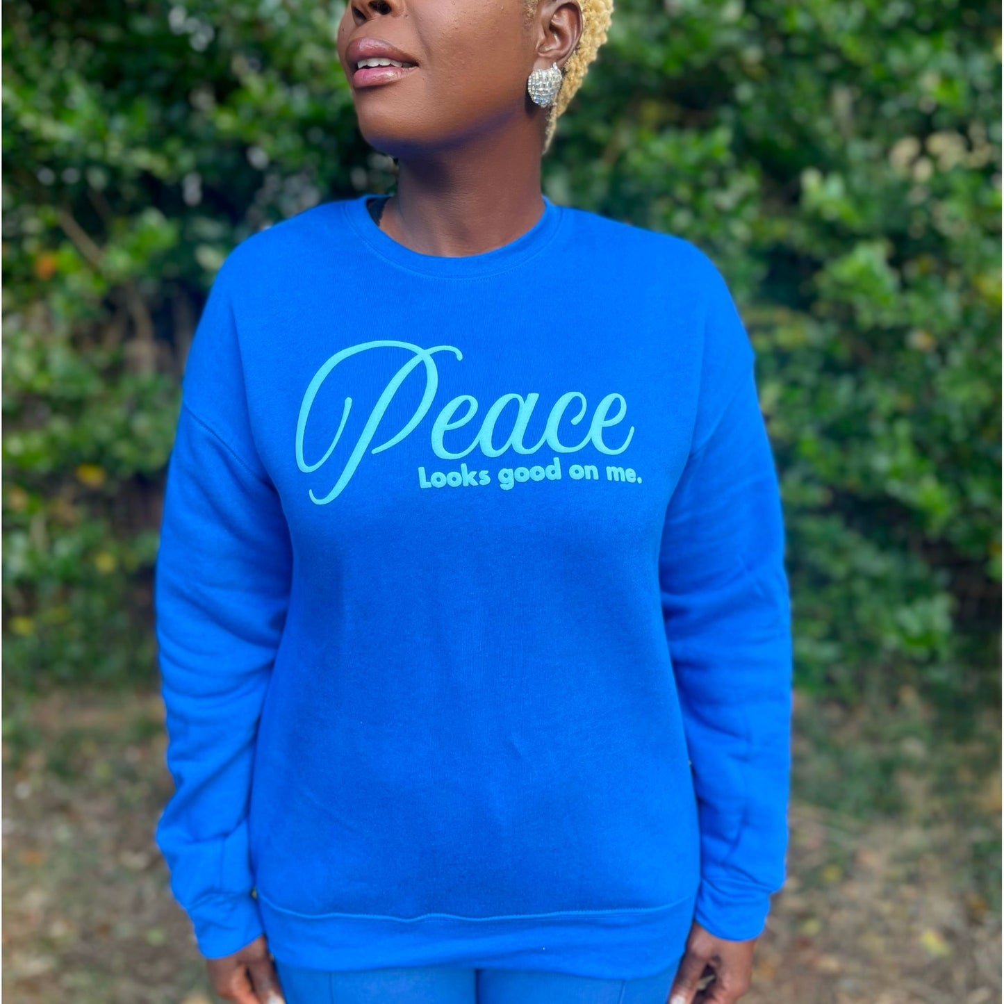 Peace Looks Good On Me royal blue sweatshirt with light blue lettering — Christian lifestyle brand
