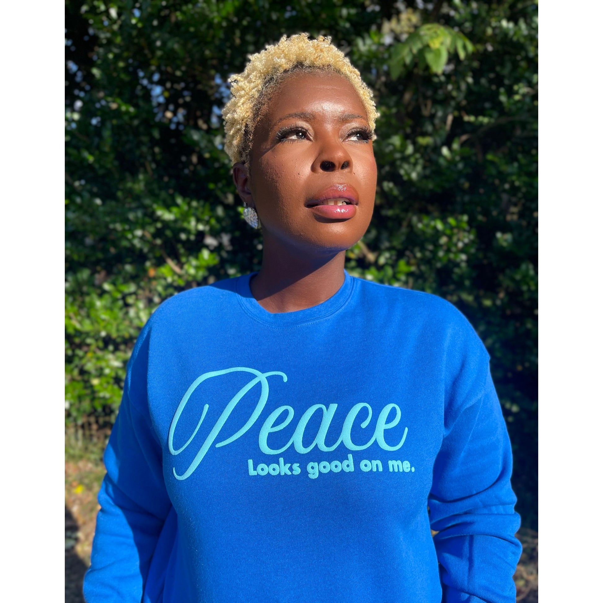 Peace Looks Good On Me royal blue sweatshirt with light blue lettering — Christian lifestyle brand
