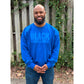 Man modeling a royal blue sweatshirt featuring the "Black excellence" design in puff print.