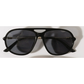 Black sunglasses with gold hardware on a white background