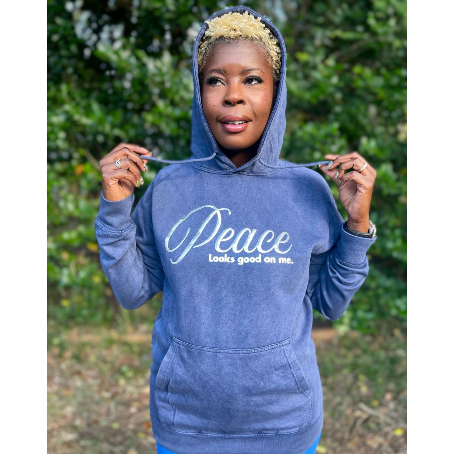 Shamere Young wearing Peace Looks Good on Me hoodie in vintage denim wash with metallic silver lettering - cozy Faith-based apparel for women
