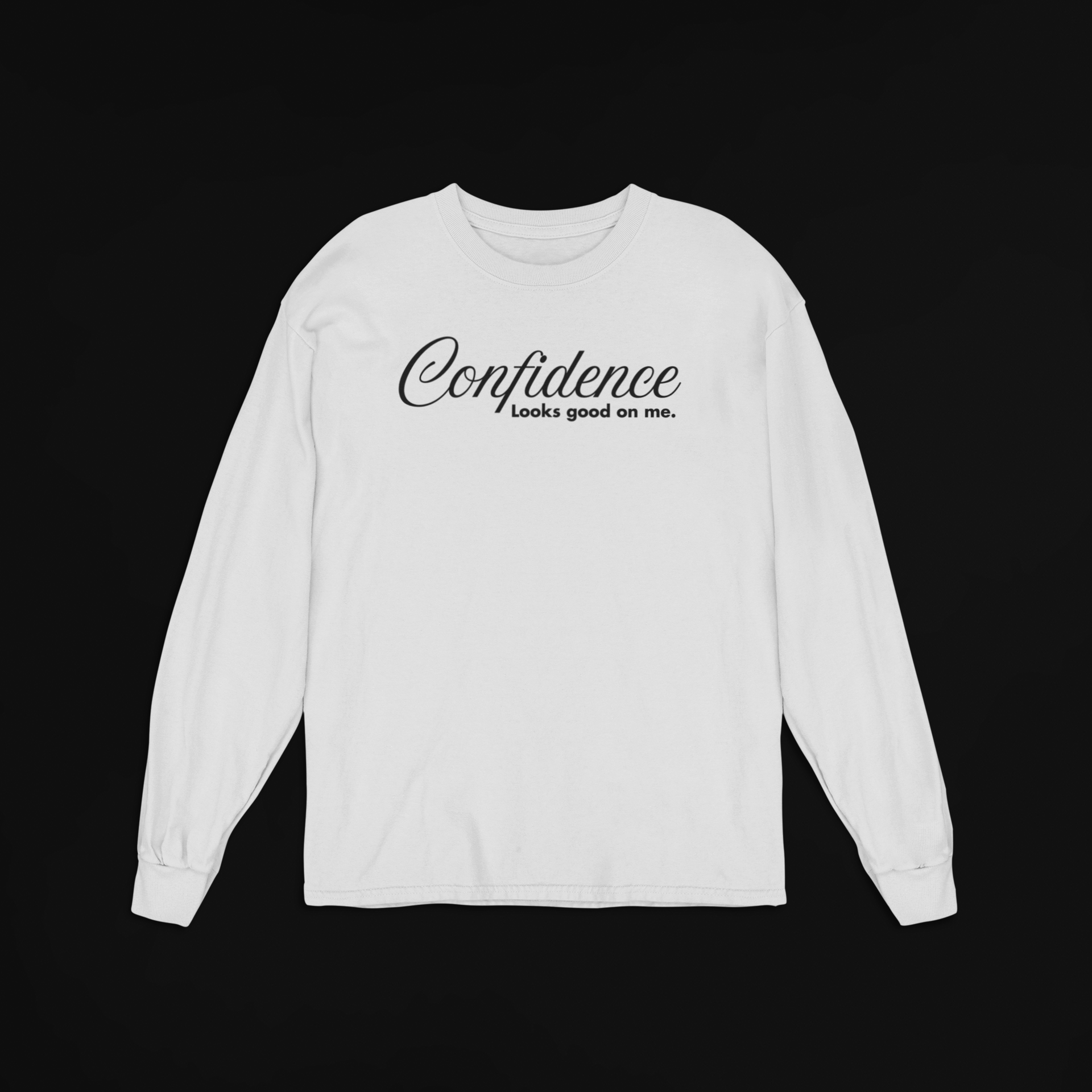 Ash grey long-sleeve shirt with 'Confidence looks good on me' text on a black background