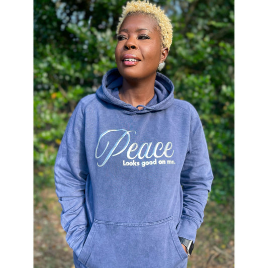 Shamere Young wearing Peace Looks Good on Me hoodie in vintage denim wash with metallic silver lettering - cozy Faith-based apparel for women