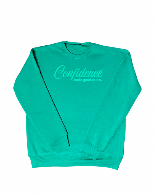 kelly green sweatshirt with puff wording saying "confidence looks food on me" on white background