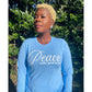 Peace Looks Good On Me Carolina blue long sleeve t-shirt with white lettering — cozy Faith-based apparel for women
