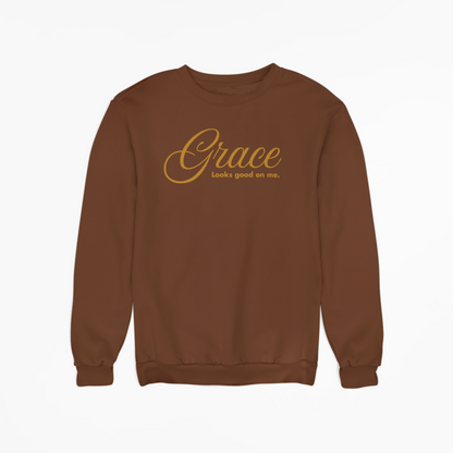 Brown sweatshirt with 'Grace looks good on me' text on a white background