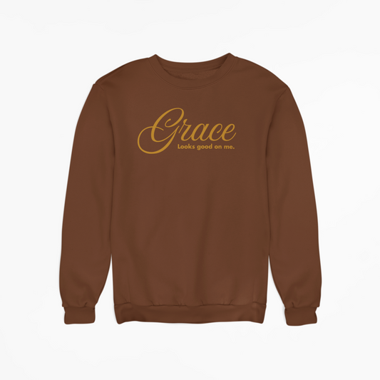 Brown sweatshirt with 'Grace looks good on me' text on a white background