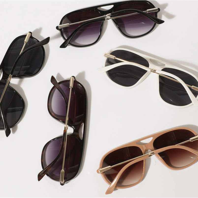 Collection of sunglasses with different frame colors and designs on a white background
